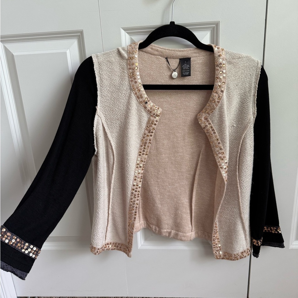 Elegant Black and Cream Sweater with Sequin Trim